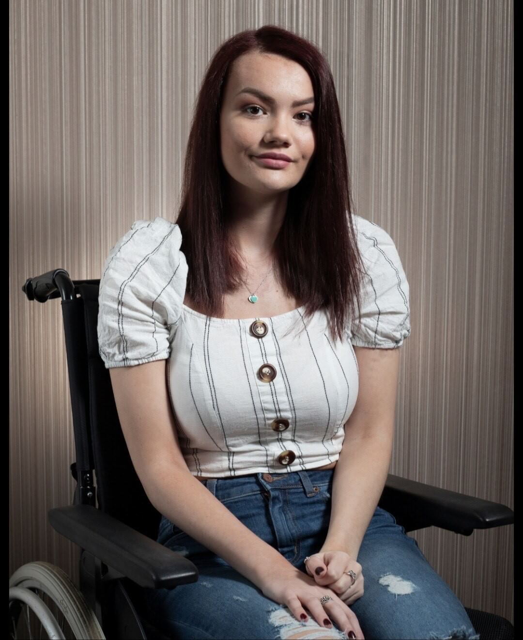 Leah looking at camera in wheelchair